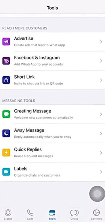 Select the tools option in iPhone on WhatsApp Business to access the away message option.
